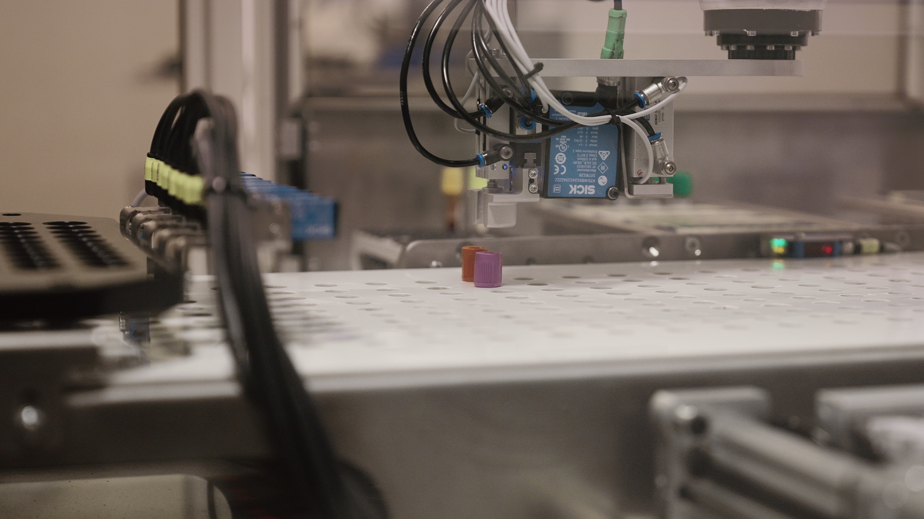 Automated test-tube handling equipment operating on a biomanufacturing line